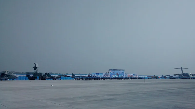 Indian Air Force personnel lined up on the tarmac with aircraft on display during the 2014 Air Force Day parade