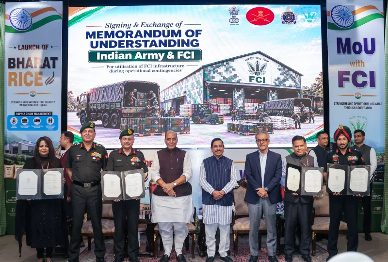 Indian Army and FCI officials exchange the MoU at the Bharat Rice launch with Rajnath Singh and Pralhad Joshi