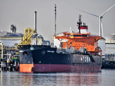 Oil tanker berthed at a crude oil terminal, representing India's rising oil import bill