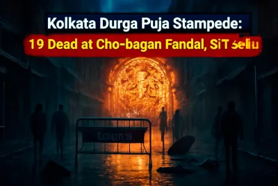 Rain-soaked Durga Puja pandal street in north Kolkata at night