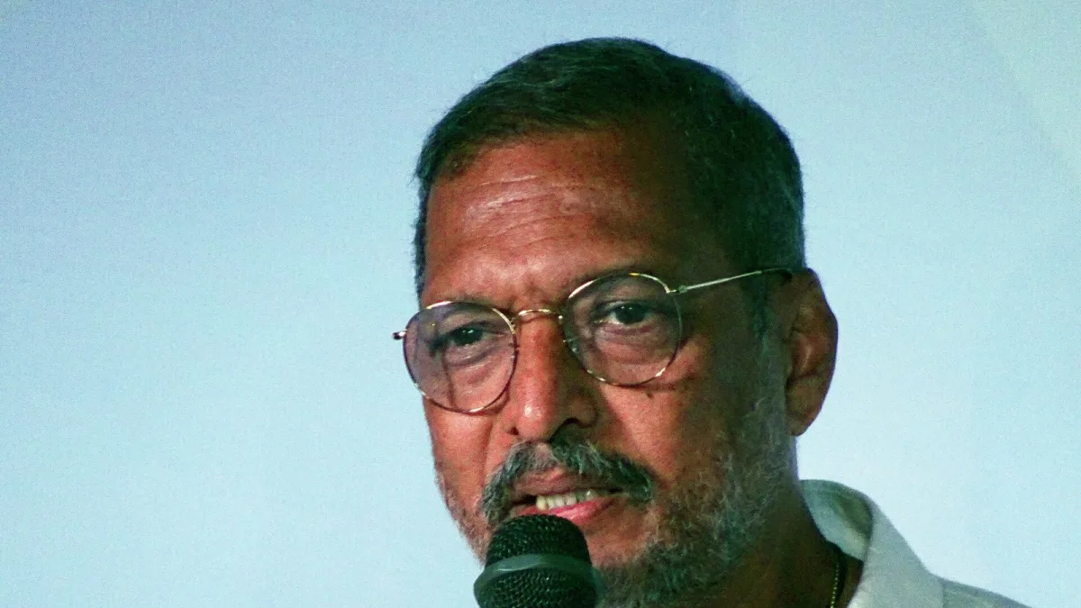 Nana Patekar speaking into a microphone at IFFI Goa in 2017