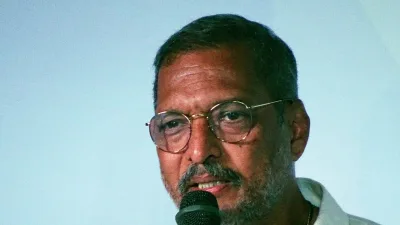 Nana Patekar speaking into a microphone at IFFI Goa in 2017