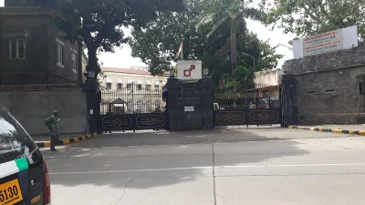 Gate of the Reserve Bank of India premises in Mumbai with the RBI logo