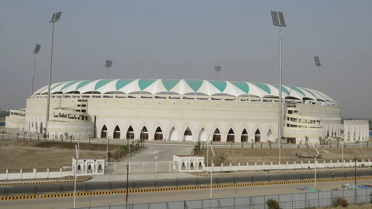 Ekana Cricket Stadium in Lucknow with its white and green roof canopy and floodlight towers